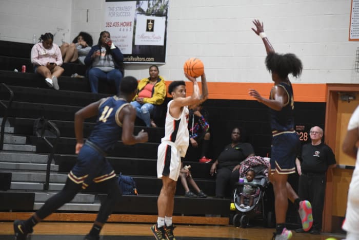 Leesburg's Derek McCray tries a 3-pointer against Wekiva. McCray had 11 points for the Yellow Jackets.